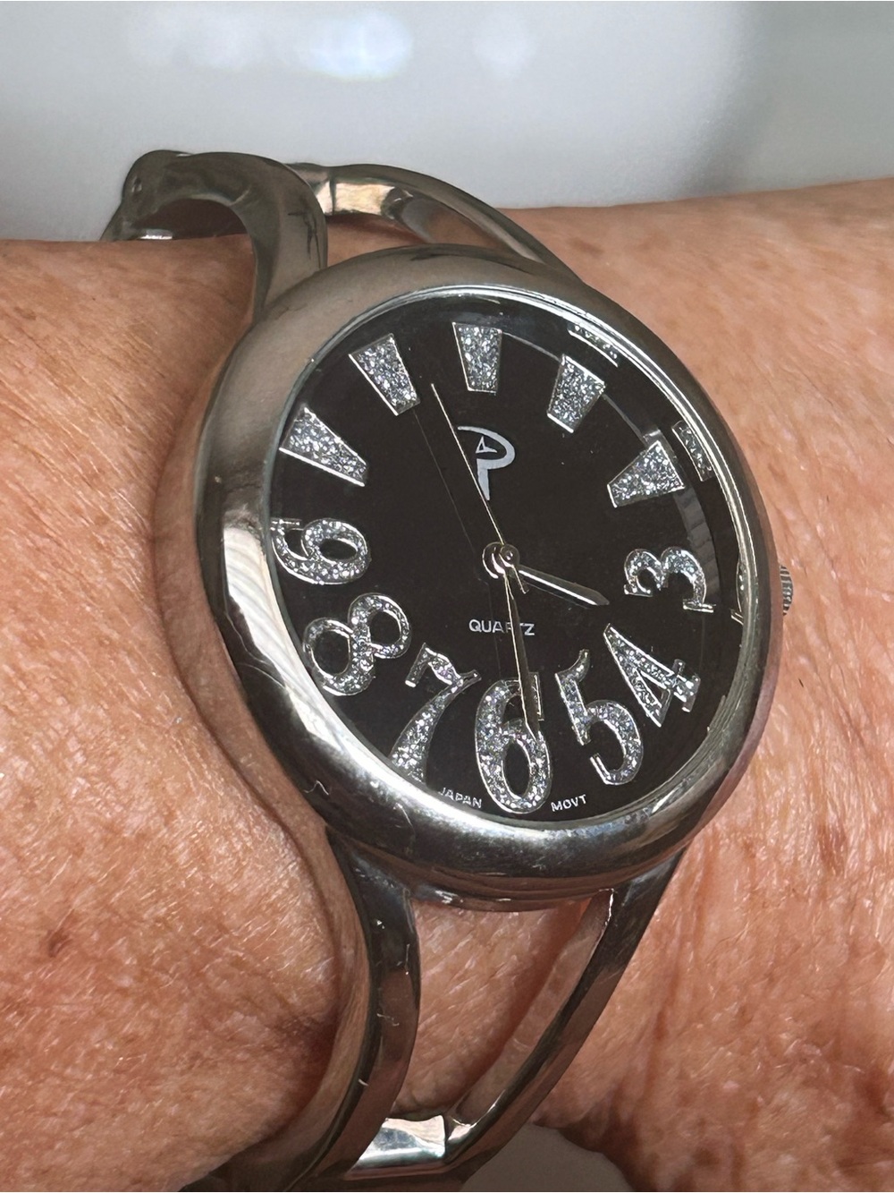 “P” quartz silver toned watch with glitter analogue numbers